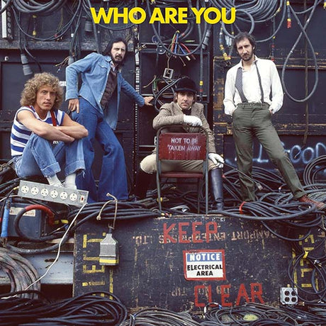 Album cover with four men posing on a construction site, featuring text 'WHO ARE YOU'.