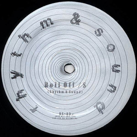 Close-up of a vinyl record label with text and concentric circles.