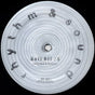 Close-up of a vinyl record label with text and concentric circles.