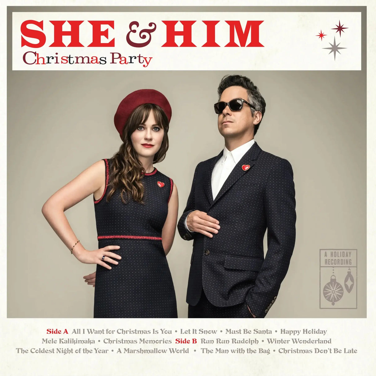 Album cover for 'She & Him Christmas Party' featuring a man and woman in formal attire.
