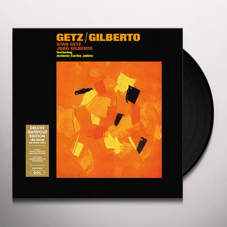 Vinyl record with 'Getz/Gilberto' album cover featuring abstract design and text.