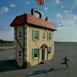 House-shaped suitcase with a person running away on a road under a blue sky.