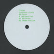 White vinyl record with green text on a black background