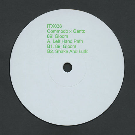White vinyl record with green text on a black background
