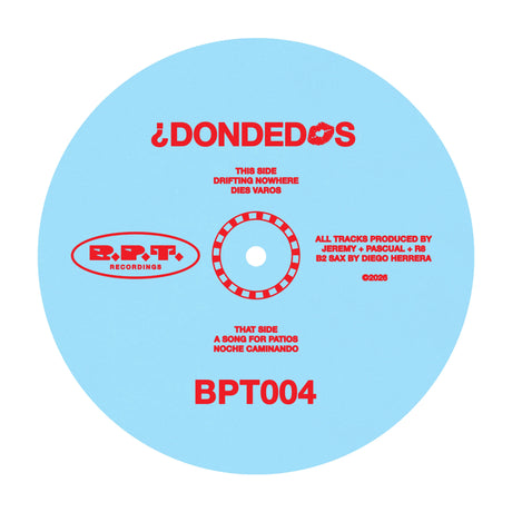 A light blue vinyl record label with red text, featuring the artist name '¡DONDEDOS' and track information for 'This Side' and 'That Side'.