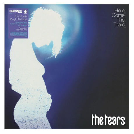 Album cover for 'Here Come The Tears' with a silhouette of a person and blue light effect.