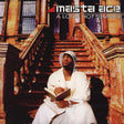 Album cover of 'Masta Ace - A Long Hot Summer' featuring an orange tinted image with a man sitting on stairs reading a book.