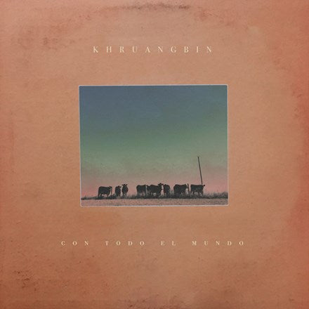Album cover for Khruangbin - Con Todo El Mundo LP featuring a landscape with cows and a clear sky.