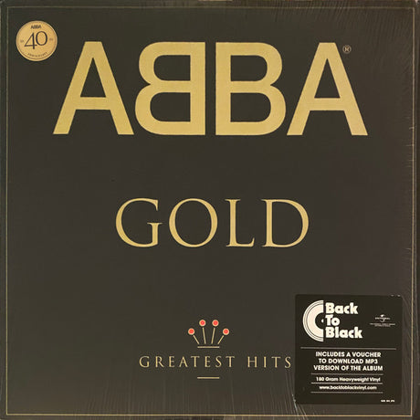 ABBA - Gold (Greatest Hits) album cover featuring the band's name in gold letters on a black background, with a badge indicating '40th Anniversary Edition' and a Back to Black record label.