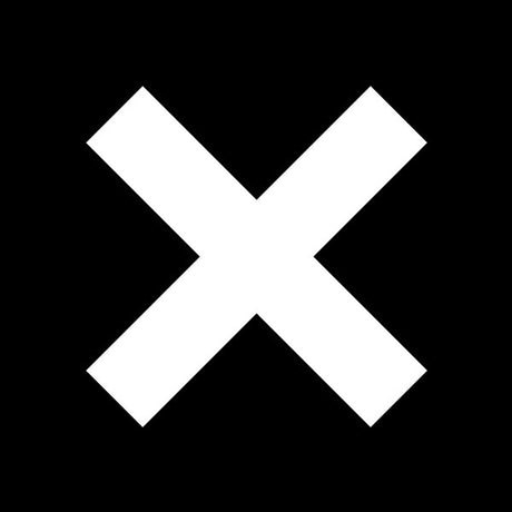 Record cover with a large white cross on a black background, representing the band The XX.