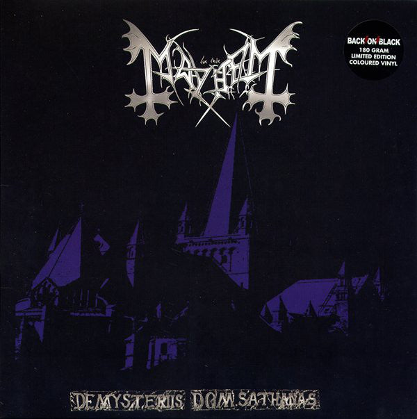 This image features the album cover for "De Mysteriis Dom Sathanas" by the band Mayhem. The cover art is strikingly atmospheric, depicting an old, dark building under a night sky with a prominent, gothic-style font displaying the band's name and the album title.
