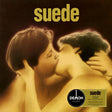 Album cover of 'Suede' featuring a photograph of two individuals in an intimate embrace, with the band's name 'Suede' displayed prominently at the top.