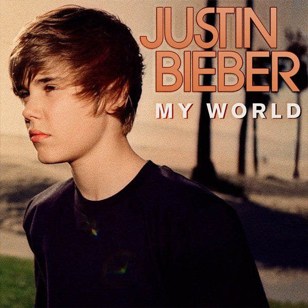 Album cover of Justin Bieber - My World featuring a black and white photo of Justin Bieber with a tropical background.
