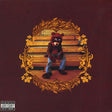 Album cover of Kanye West - College Dropout featuring an image of a child wearing a teddy bear costume sitting on a bench with a decorative, ornate border.