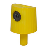 A yellow colored spray paint cap with a black dot for spraying thin lines.