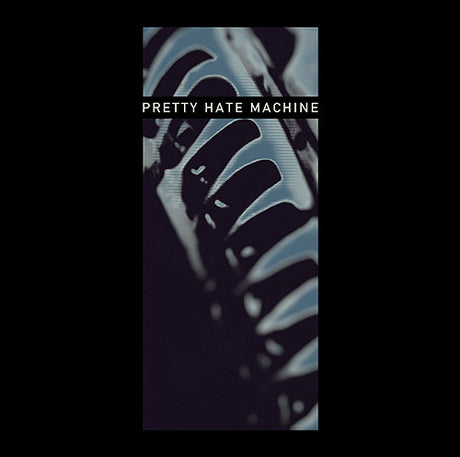 An album cover featuring a close-up of what appears to be a mechanical device, possibly a part of industrial equipment, with the text 'PRETTY HATE MACHINE' displayed.